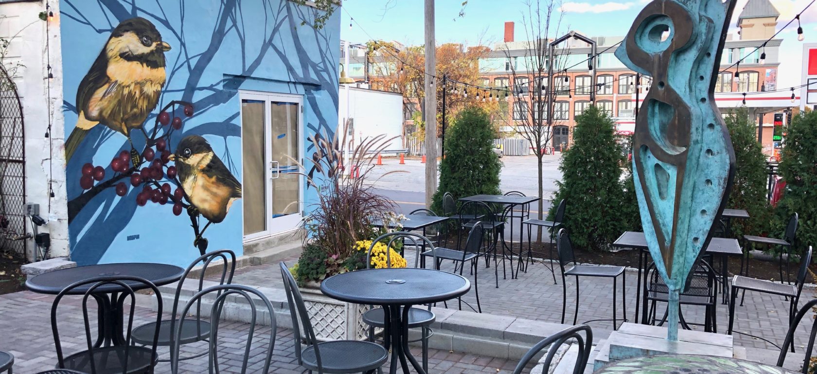 Mural by Ricky Vespia and sculpture by Anthony Quinn at Olga's Cup and Saucer and Tiny Bar